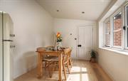 Dining area and door to ground floor double room 