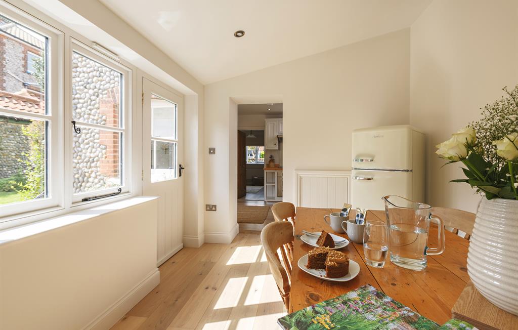 Dining area with view of kitchen entranceway