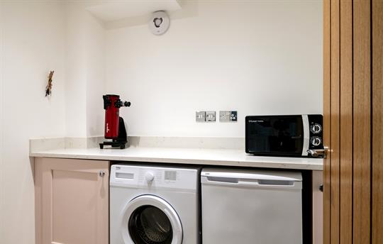 utility room telescope, washing machine and fridge