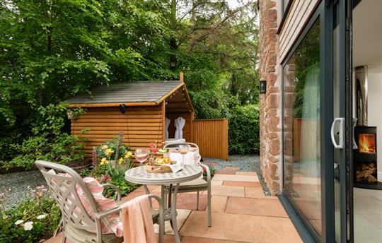 private patio with cottage garden and hot tub