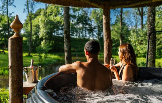 Covered preheated hot tub over looking the lake