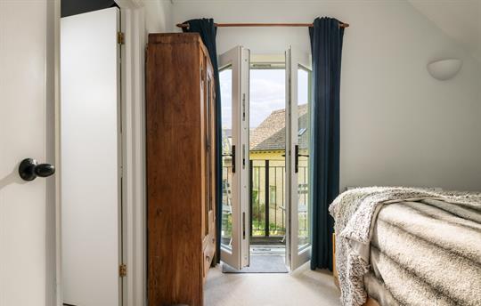 Bedroom 1 ensuite with balcony onto Water Garden