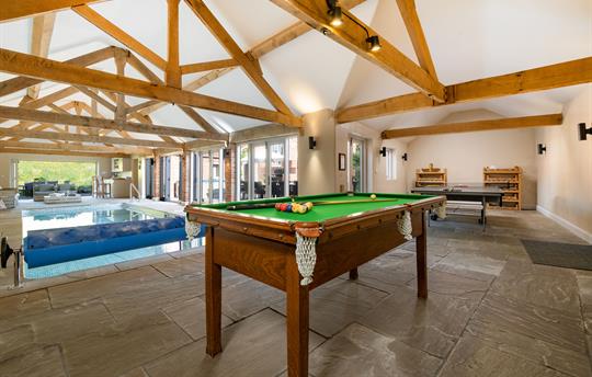 Games area with pool table, darts and table tennis