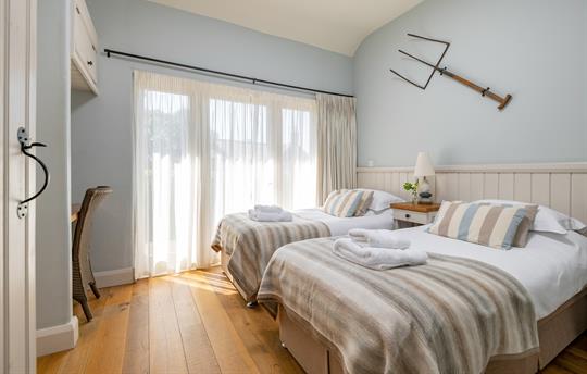 Cartshed bedroom made up as a twin room