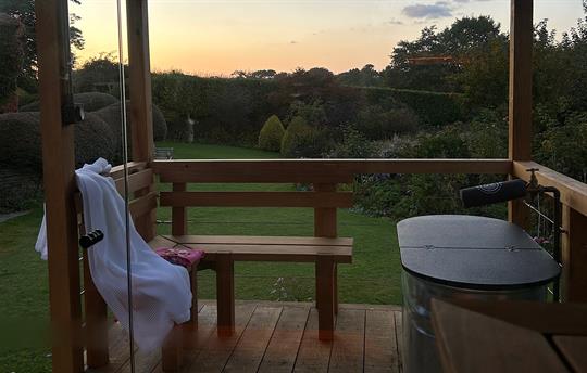 Sun set over the garden, view from the sauna
