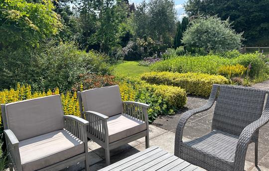 Outdoor seating and lovely mature garden