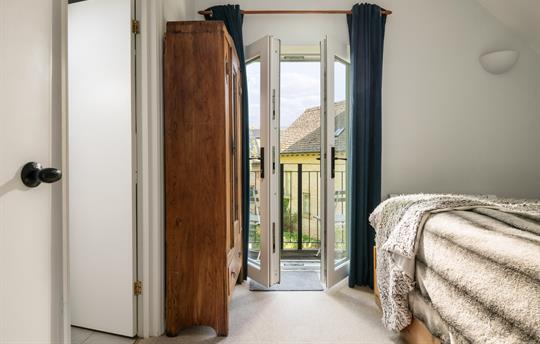 Bedroom 1 ensuite with balcony onto Water Garden