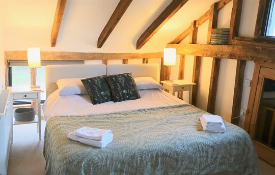 Granary bedroom overlooking front pond