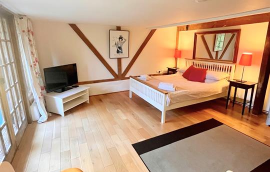 Ground floor bedroom leading to decking area