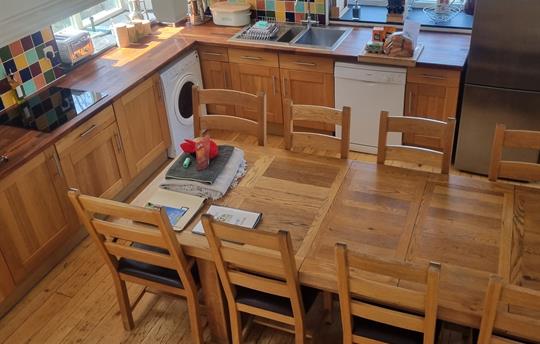 Extending table seat 10 when booked with the Roost