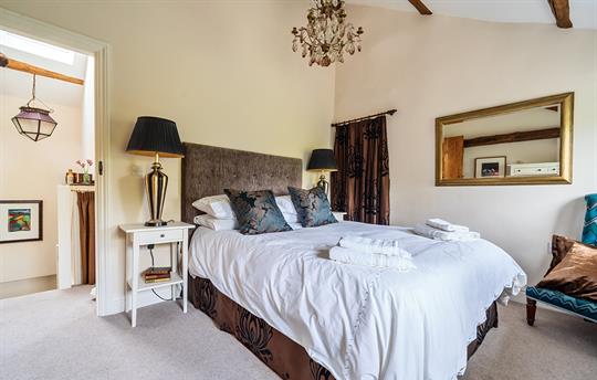 Bedroom King size bed, antique chandelier