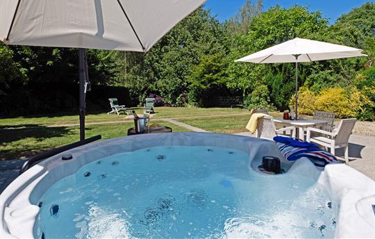 Hot tub at Garden Cottage with private garden view