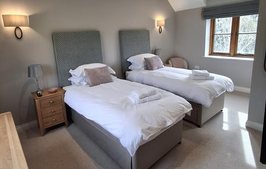 Two single beds with zip & link option