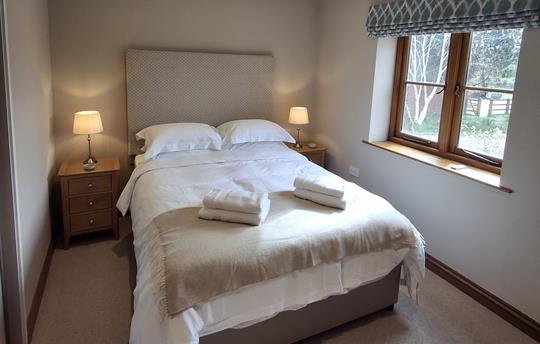 Downstairs bedroom with king size bed