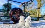 Sunny winters day - snowmen by the fireball