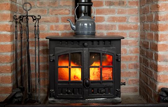 Cosy log burner and oil fired heating