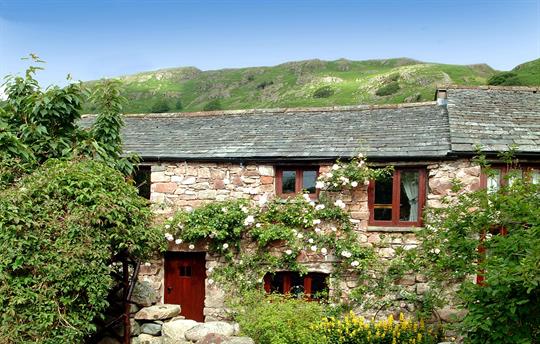 Fells rising behind cottage