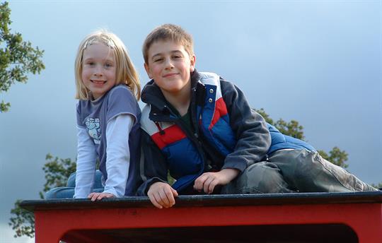 Children on play equipment